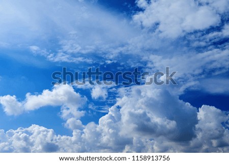 Perspective view of romantic navy blue sky with white grey clouds. Before the rain. High resolution artistic skyline background image