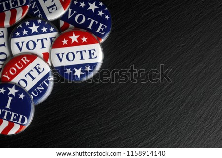 Red, white, and blue vote buttons background Royalty-Free Stock Photo #1158914140