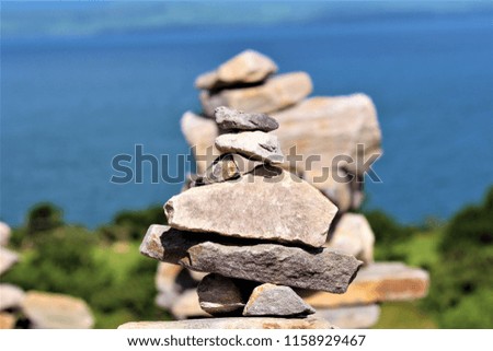 Simplistic piles of stones on an Irish beach