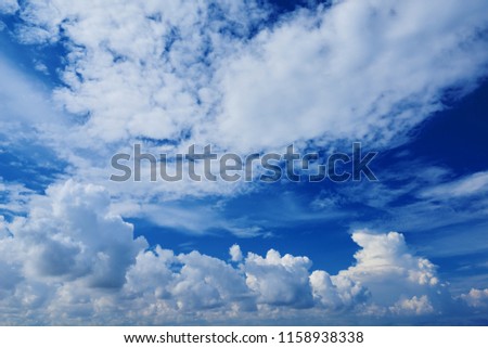 Perspective view of romantic navy blue sky with white navy clouds. Beautiful sky. High resolution artistic skyline background image
