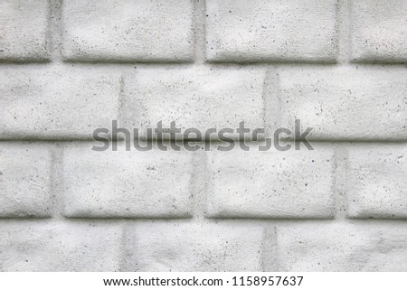 White wall with big brick. Interesting background. Cool brick texture.