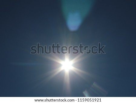 A deep blue lens flare overlay effect.