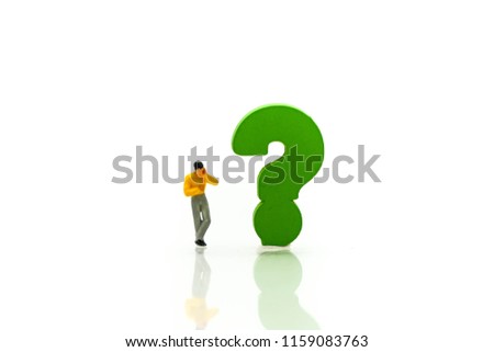 Miniature people : Businessman with THE QUESTION MARK using for concept Punctuation Day