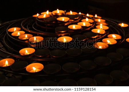 Lighting candles in the church