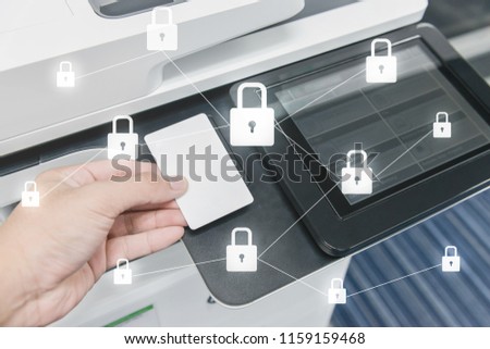 Business man hand is using smart card to printing document with locked key icon for data protection concept  Royalty-Free Stock Photo #1159159468