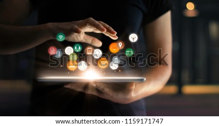 Digital online marketing commerce sale concept. Woman using tablet payments online shopping and icon customer network connection on hologram virtual screen, m-banking and omni channel. Royalty-Free Stock Photo #1159171747