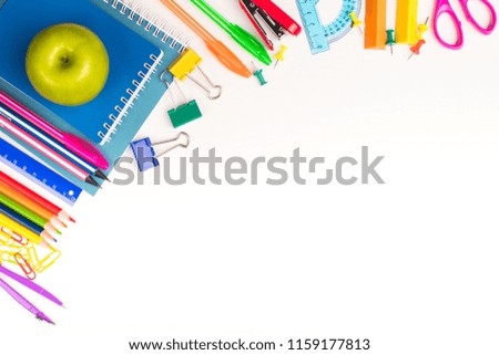 School Or Office Stationery With Green Fresh Apple On White Background Of Table With Copyspace Top View.