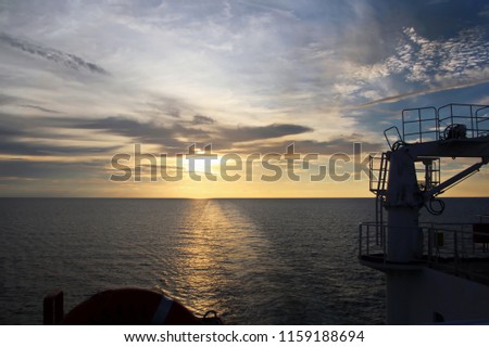 Sunset in the Pacific Ocean. Various types of sunset from the side of the ship when underway and anchored in the port. Riot of colors of the ocean, clouds and sun.