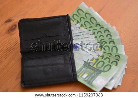 a wallet full of banknotes