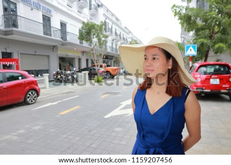 a woman with hat in summer