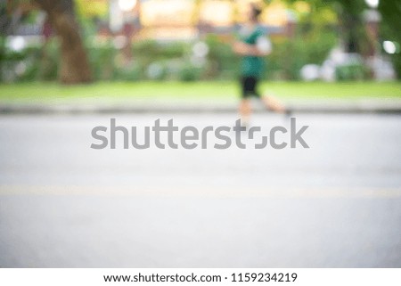Abstract motion blurred of Healthy lifestyle jogging in the public park as concept. Closeup of feet or footwear.