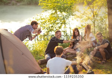 friendly company drinking tea in landscape. free time , rest time concept. photography concept