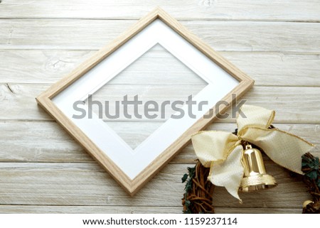 Christmas or new year 2019 concept background with copy space. Christmas empty photo frame and gift present boxes on white wooden background.
