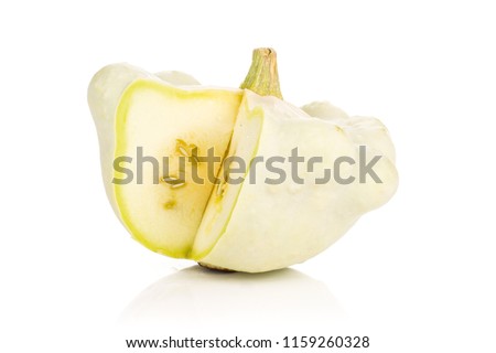 One whole sliced summer white pattypan squash isolated on white background