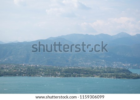 Fantastic view of Garda lake with the mountains in the background