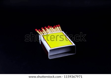 Matching sticks and yellow matchboxes