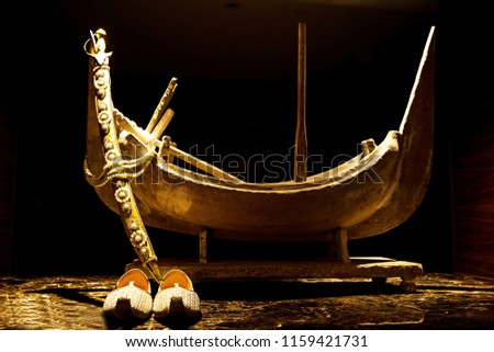 Golden Boat with sword and Khussa.