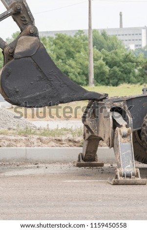 The process of asphalting roads. Machinery for asphalting roads. vertical photo