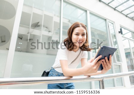 University student is holding tablet 