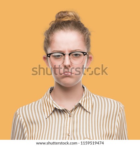 Young blonde business woman depressed and worry for distress, crying angry and afraid. Sad expression.