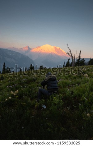 This is a picture of a photographer taking pictures of Mount Rai