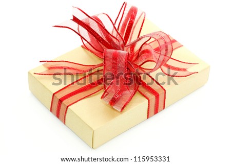 Gold gift box on white background with a nice red bow