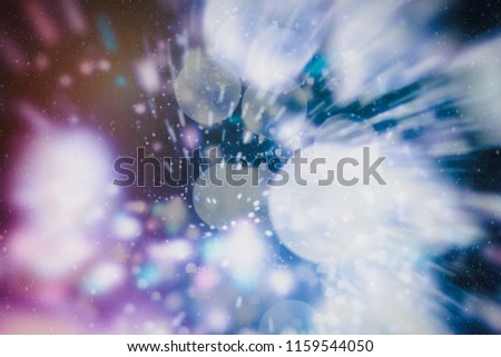 Bright abstract circular bokeh background blur on a dark background