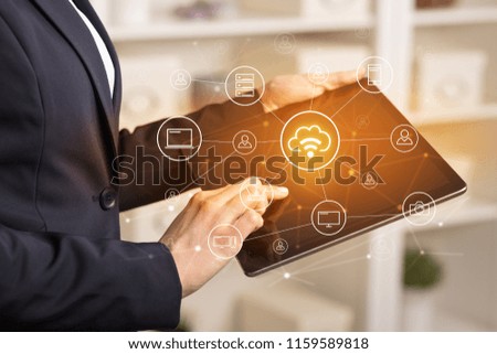 Business woman using tablet with network security and online storage system concept