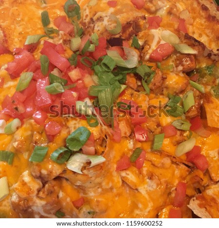 Cheesy Nachos with Barbecue BBQ Chicken - Topped with Tomatoes Green Peppers and Onions