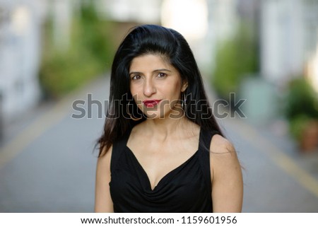 a headshot of a beautiful indian woman