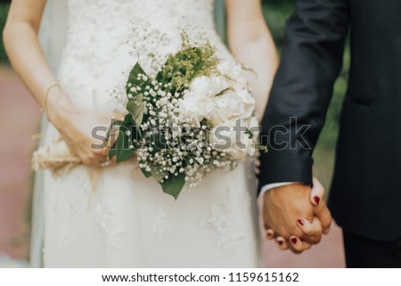 bride, groom and flowers