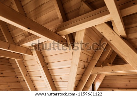 Wooden joints in ceilings in a wooden hut. Royalty-Free Stock Photo #1159661122