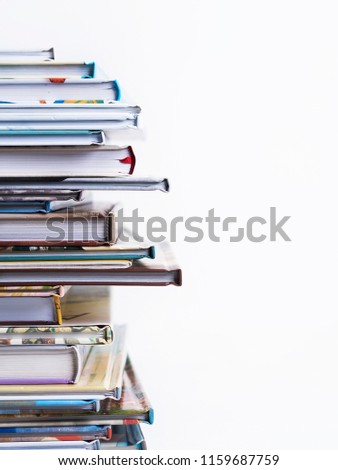 Close view of  Stack of children's books on a white background