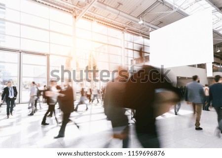 crowd of people at a trade show. copyspace for your individual text.