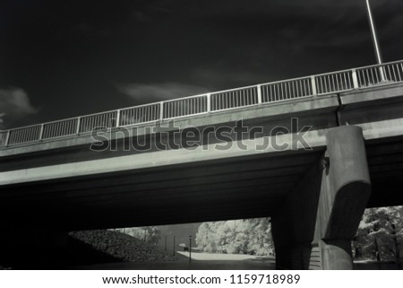 Infrared Photography, Concrete And Metal Bridge Spanning Large River