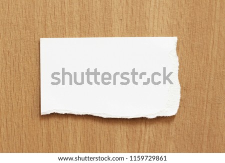 white torn paper texture on wood background, copy space.