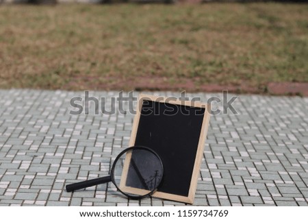 chalk board and magnifying glass for science experiment