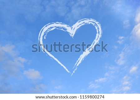 Heart-shaped on blue sky.