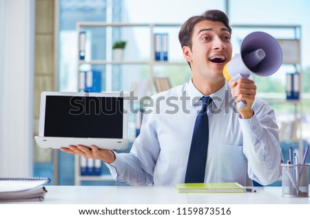 Businessman with loudspeaker presenting at his laptop