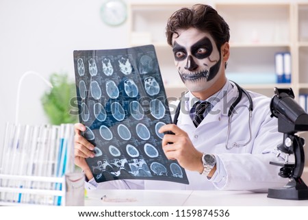 Scary monster doctor working in lab Royalty-Free Stock Photo #1159874536