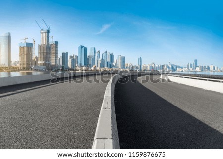 Highway pavement and skyline of Qingdao urban construction

