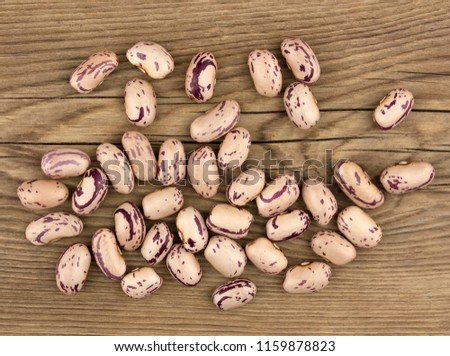 Haricot beans on wooden table, healthy food and nutrition