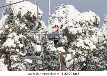 Ski lift and slope on a snow landscape. Winter sport