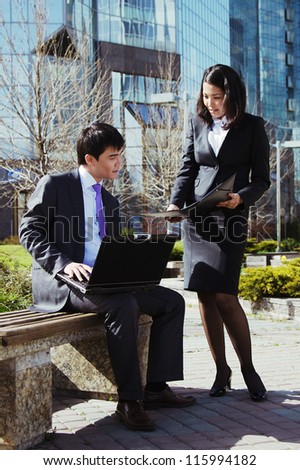 Business people meeting outdoor in front of office building