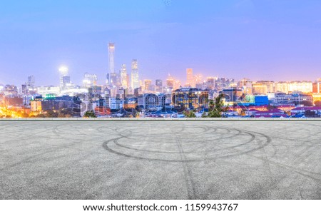 Panoramic beijing skyline and buildings with empty asphalt road