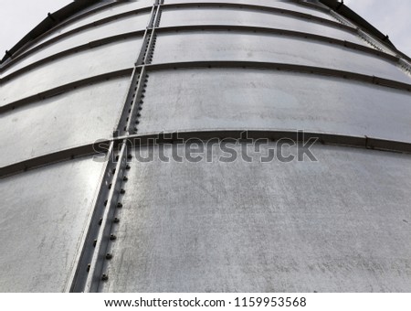 metal sheets of the wall construction for storing grain crops, cereals and other agricultural crops before processing, the sheets are joined using bolts, nuts