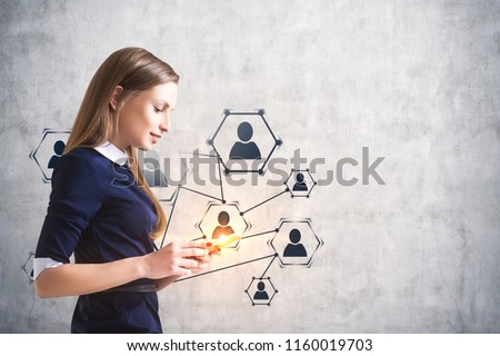 Side view of a smiling calm businesswoman looking at her smartphone screen. Human resources network icons over concrete wall. Toned image mock up