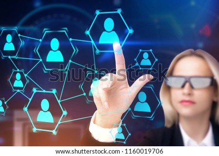 Blonde businesswoman in AI glasses touching hr network hologram interface. Blurred office background. Toned image double exposure mock up