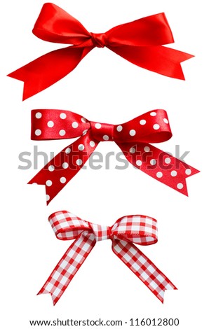 Three types of isolated red ribbon bows on white background.  One plain, two patterned with polka dots and checks. Royalty-Free Stock Photo #116012800