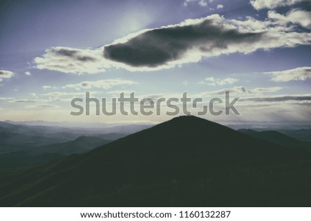 
Hills and forest at sunset